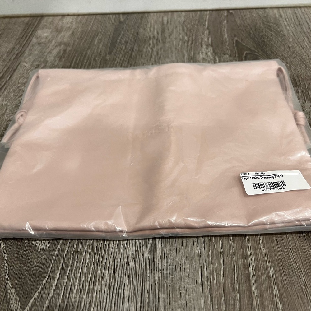 Rose Inc vegan leather drawstring bag.